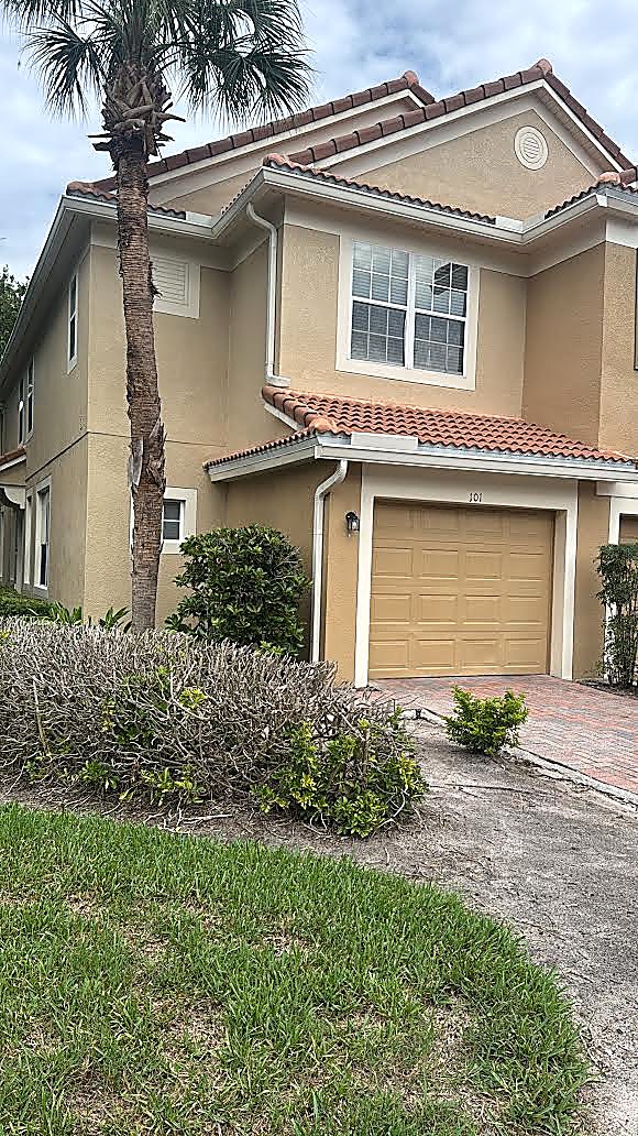 Home with tile roof gutters and splash guard protection