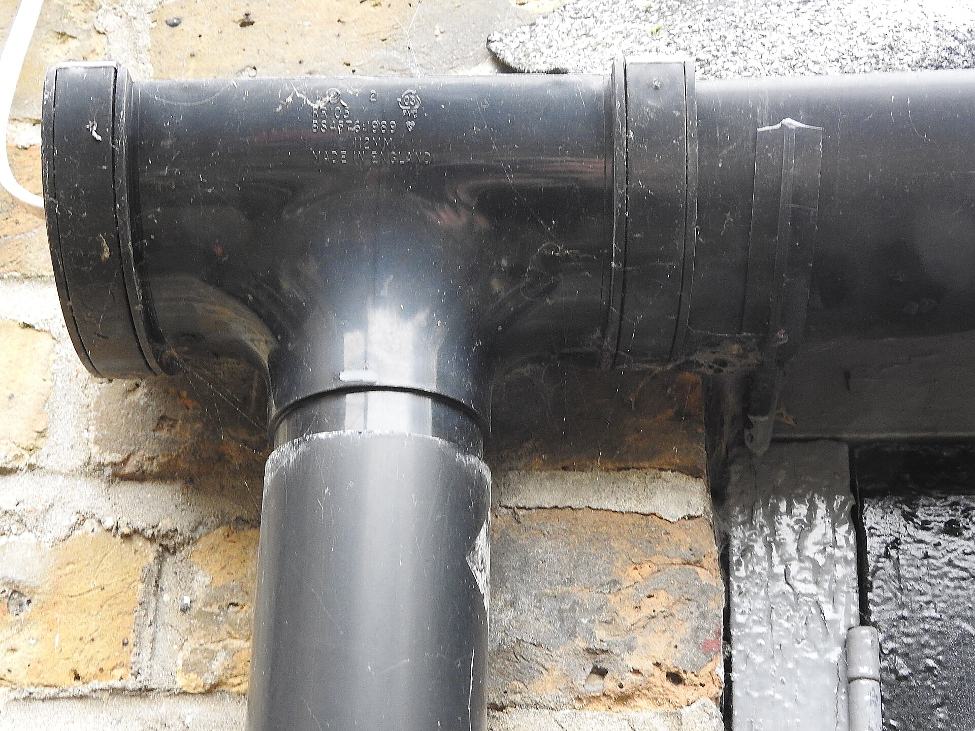 Completed gutter and downspout system on a home